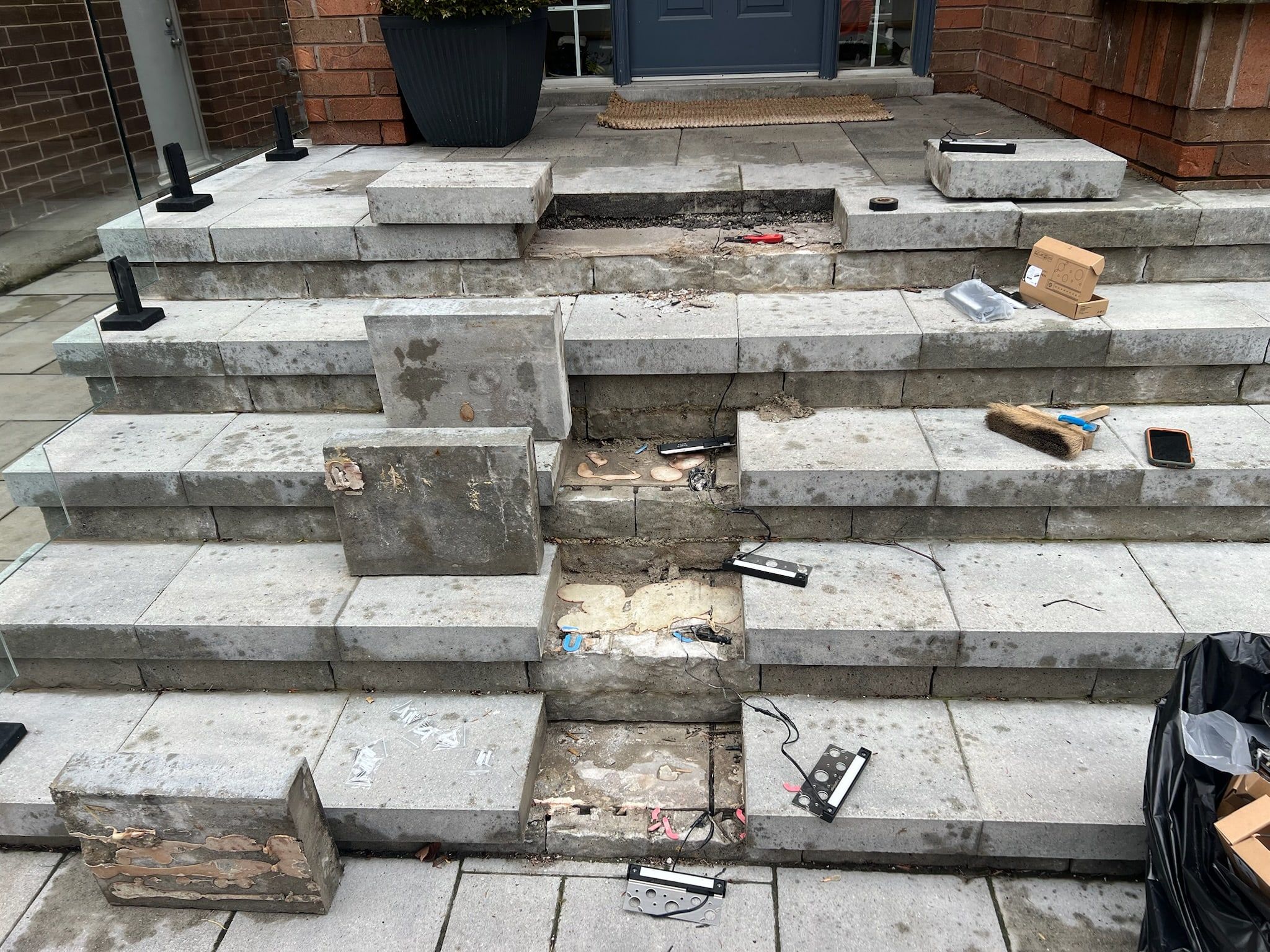 Before: the stone steps lifted during installation, with fixtures and wiring set in place.