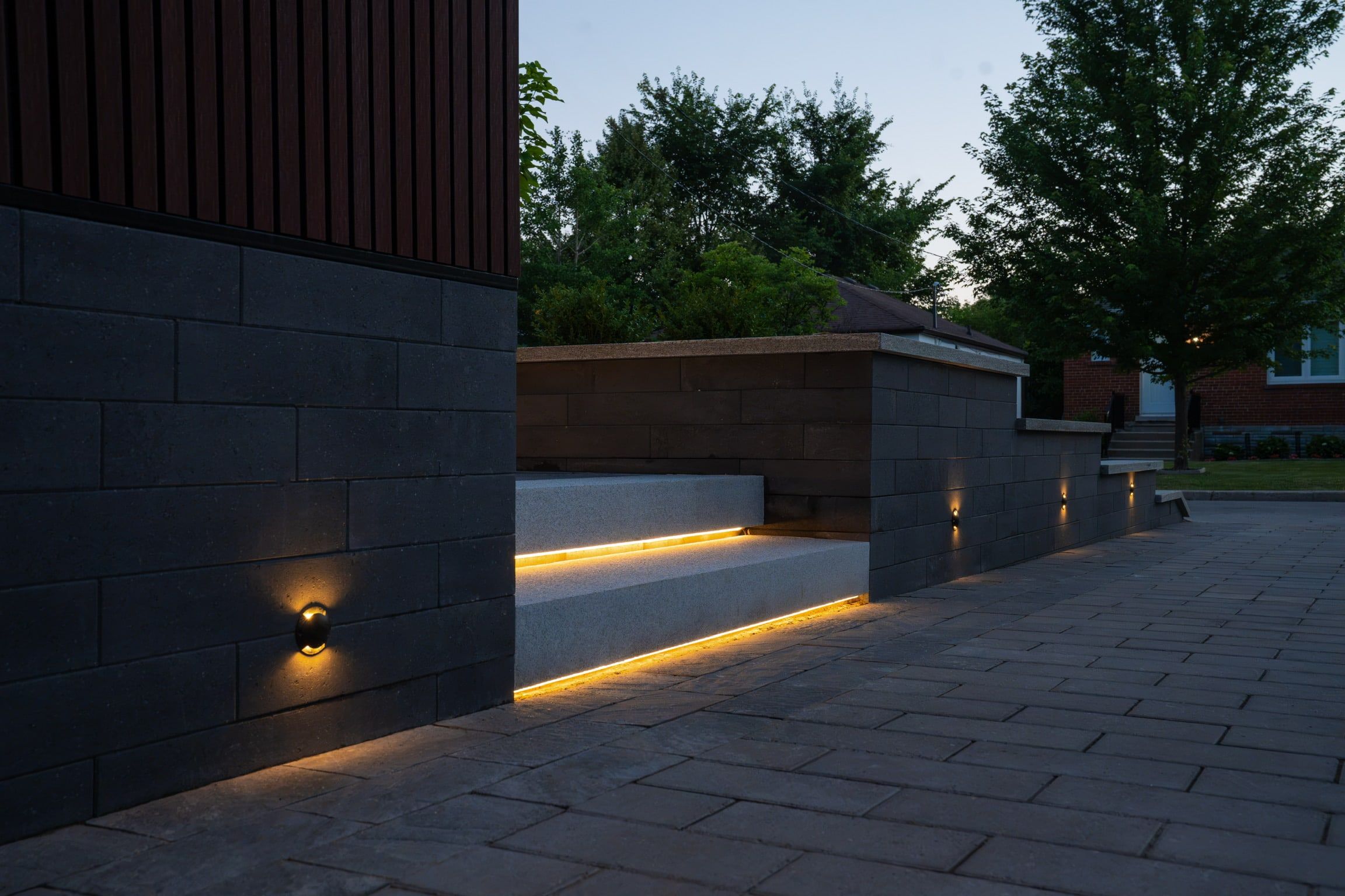 A light line under a stone bench along the side wall.